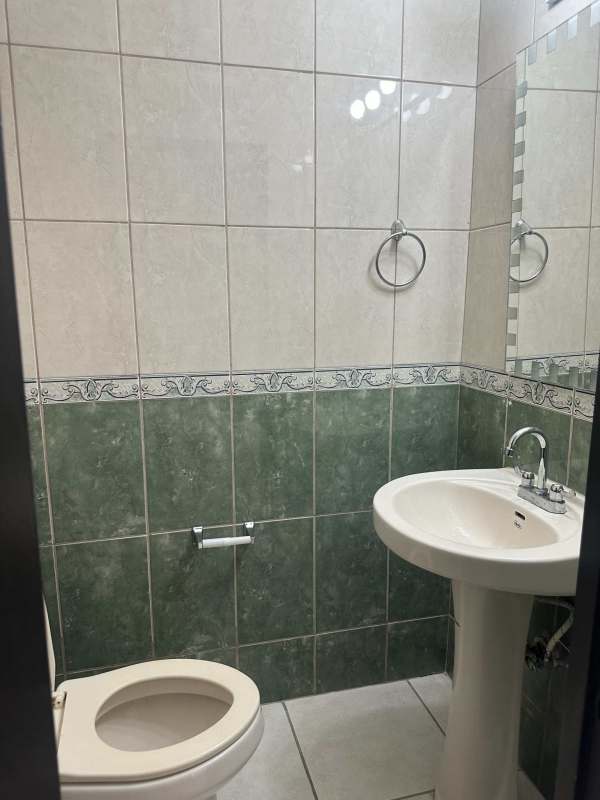 Kitchen with granite countertops, tile backsplash and natural light in PH Sky View Hato Pintado Panama