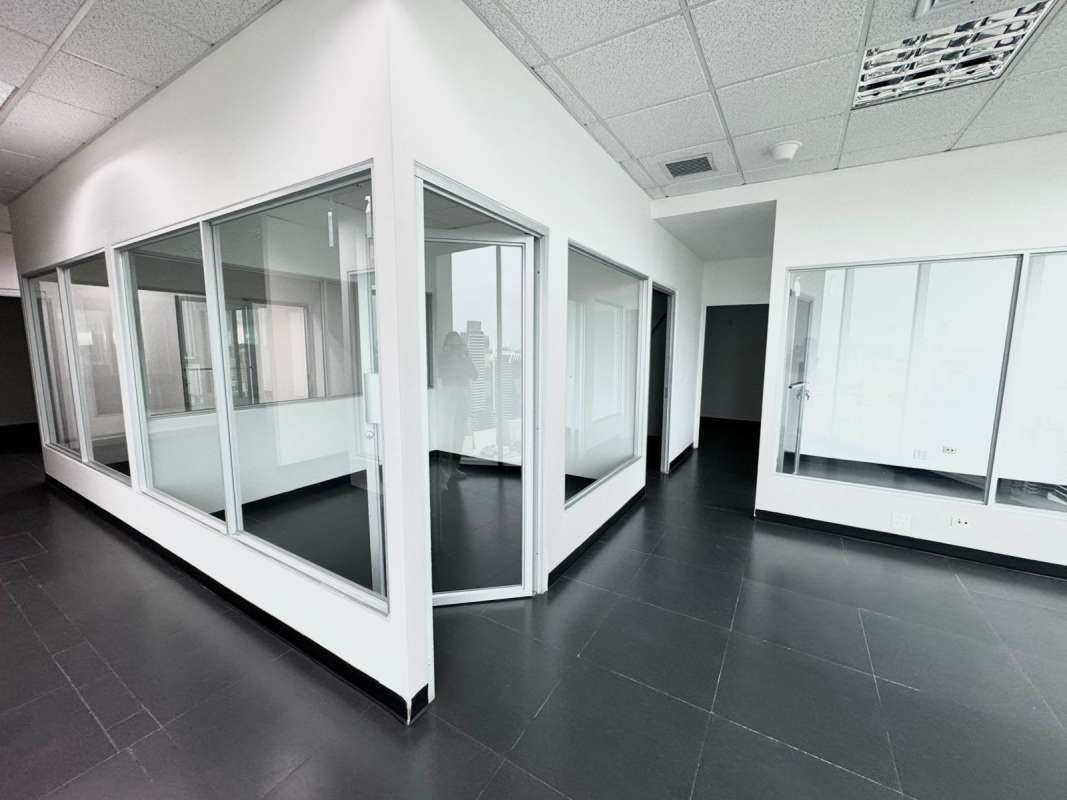Office corridor with glass walls in PH BICSA Tower high-rise Panama