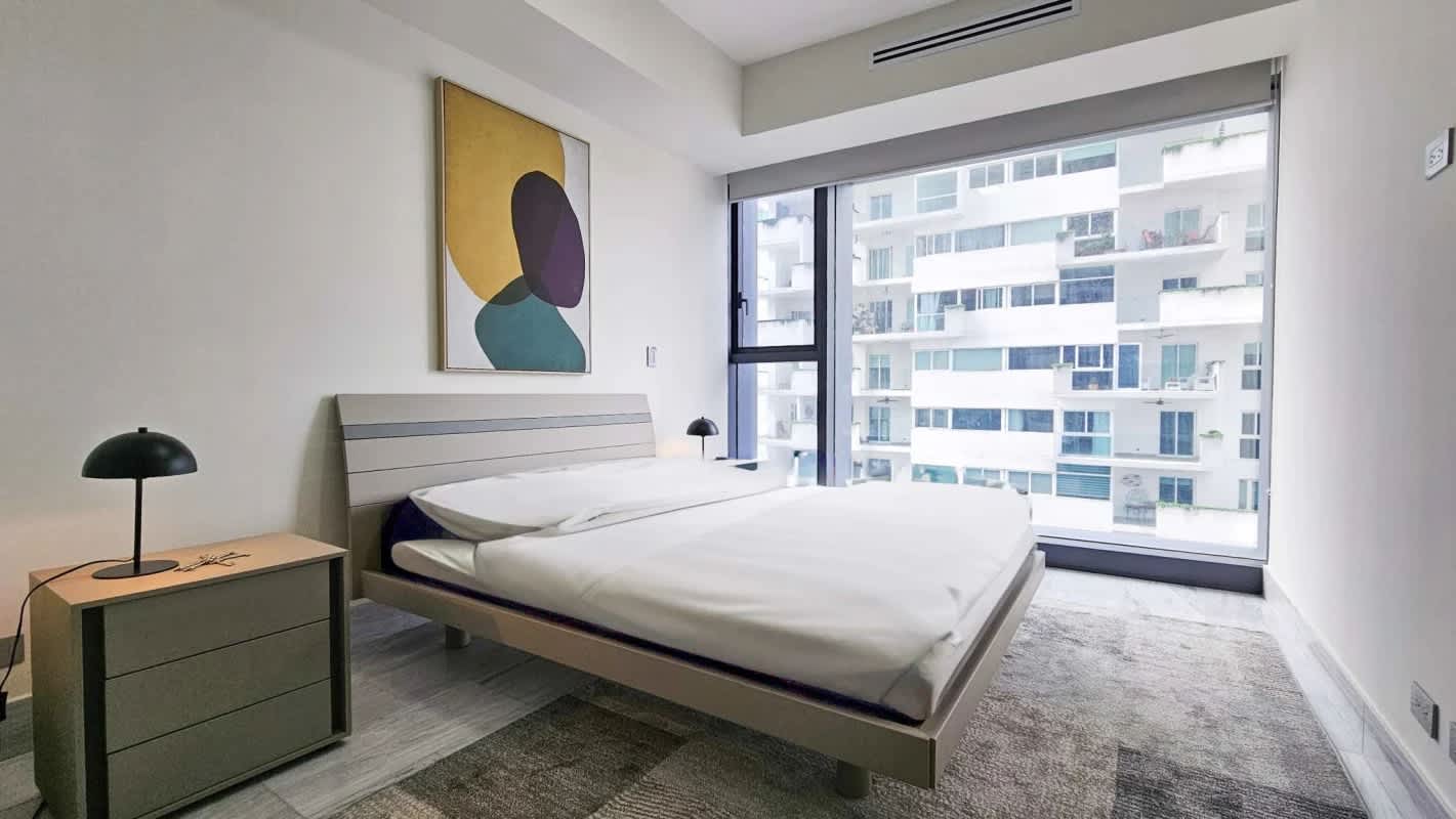 Bright furnished bedroom with panoramic city & ocean views in PH BICSA Financial Center Panama