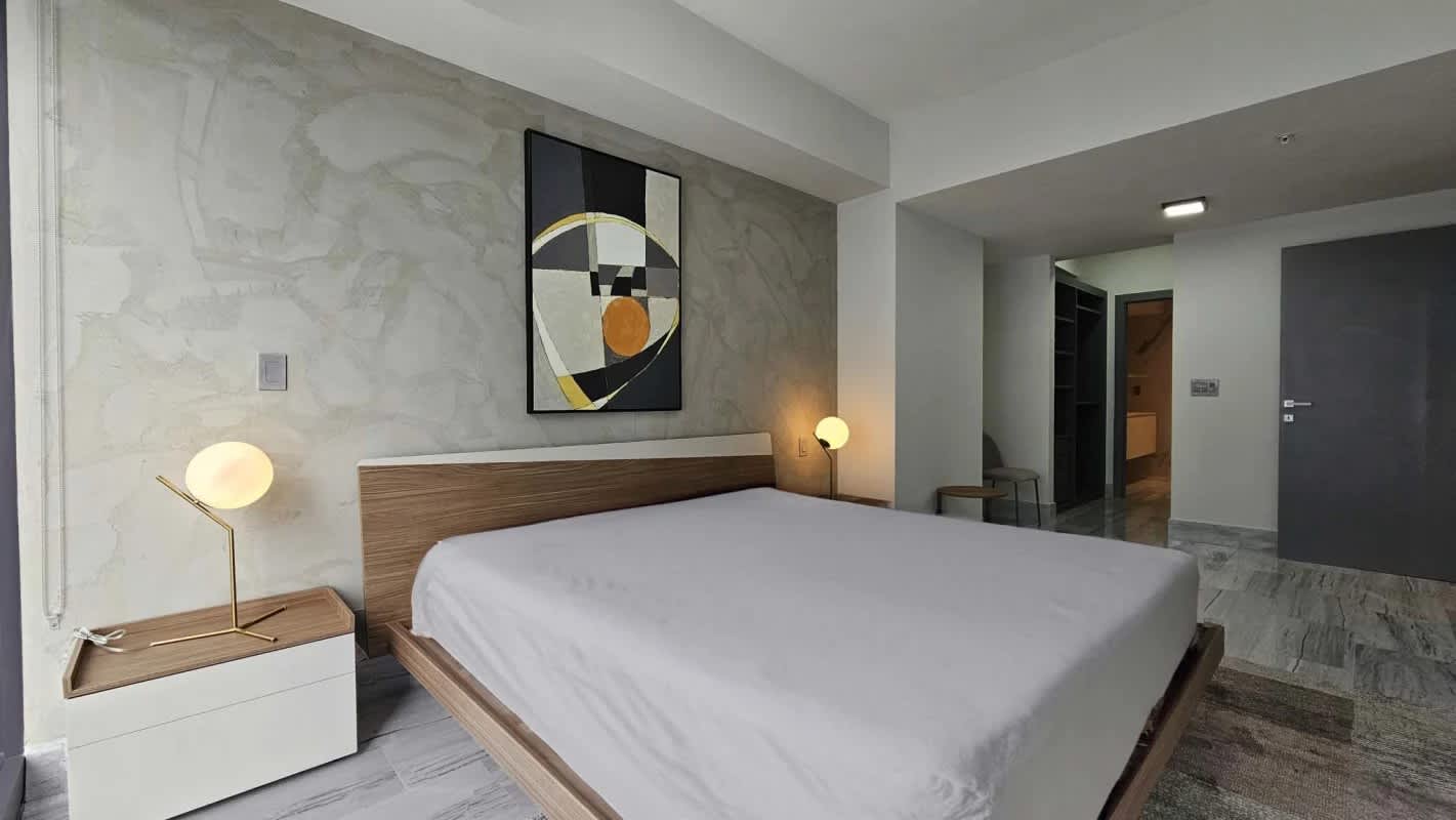 Spacious bedroom featuring built-in closets and marble floors at PH BICSA Panama City
