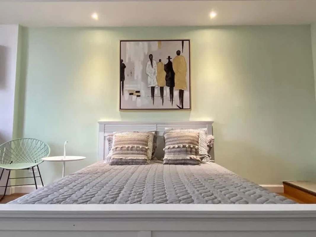 Bedroom with modern decor, rented as Airbnb or long-term unit in Calidonia Panama income property.