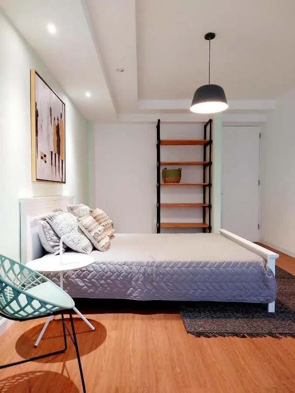 Modern tiled bathroom with vanity in Airbnb apartment at hotel income building Calidonia Panama.