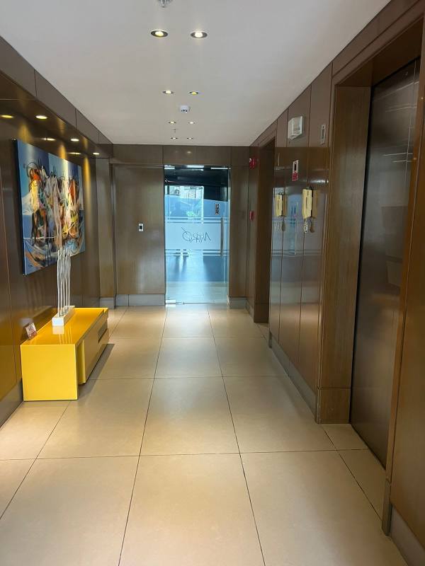 Bright living room with city view, ceramic tile floor, large windows at PH Miro Via Argentina Panama City