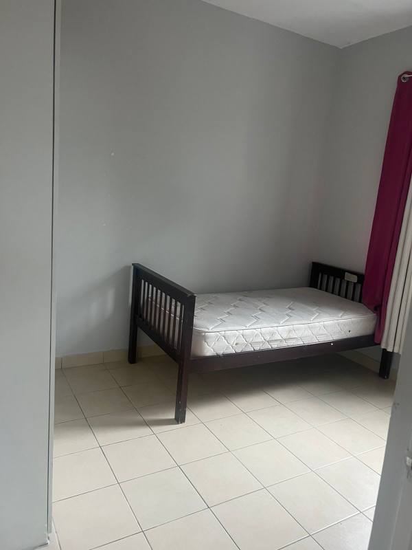 Bedroom with built-in closet and tile floor in PH Las Hortensias Carrasquilla Panama