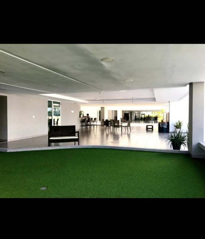 Covered terrace lounge area with seating and greenery at PH El Cangrejo City Center Panama