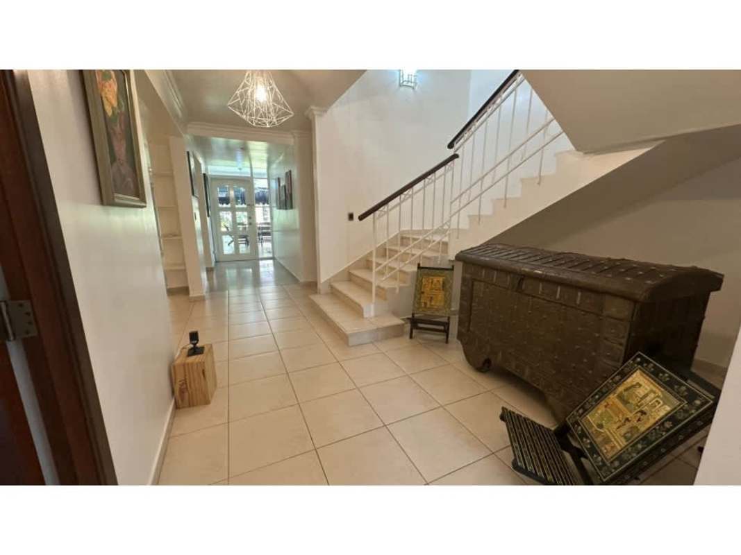 Modern kitchen with granite countertops, stainless steel appliances, and large windows in upscale Panama house