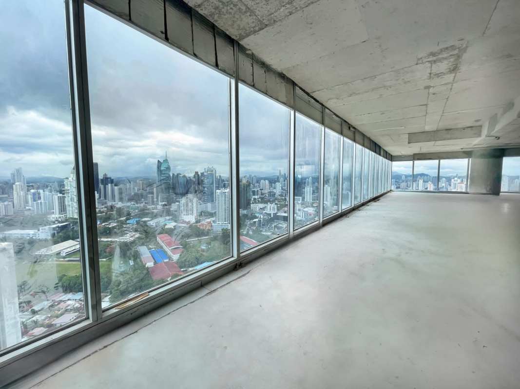 Spacious unfinished commercial space with floor-to-ceiling glass and skyline views at Oceania Business Plaza Panama
