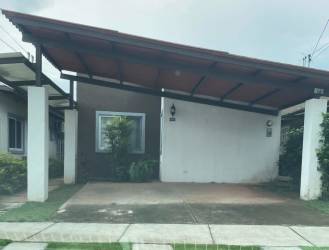 Front exterior view contemporary one-story house with carport Villas de Arraijan Panama