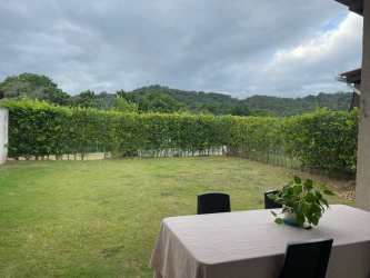 Patio area with dining overlooking garden and mountain views in Villas de Arraijan Panama