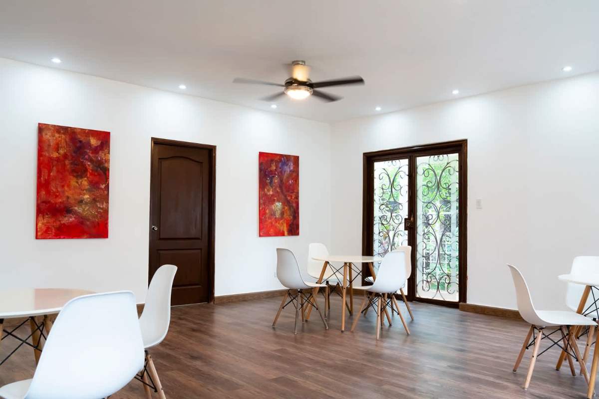 Bedroom with wood floor, window blinds, AC in house for sale Obarrio Panama City