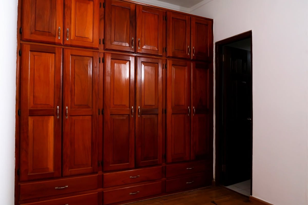 Bedroom with built-in wooden wardrobe drawers cabinets house Obarrio