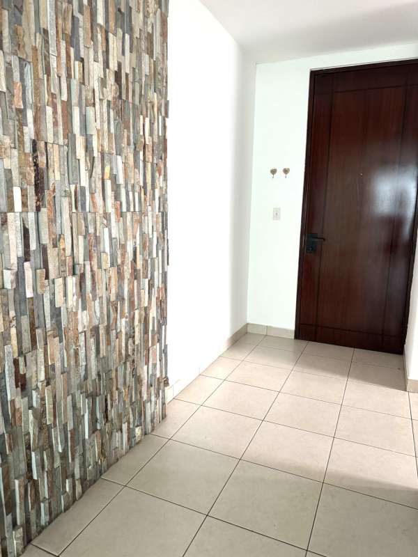 Entry foyer with stone accent wall and tile flooring at PH San Francisco Vista Panama