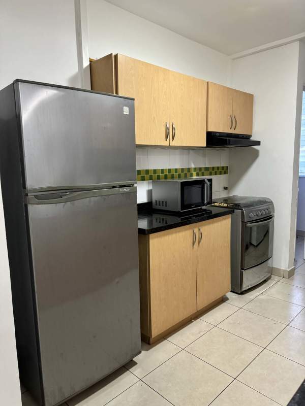 Bathroom with glass shower, marble vanity and wall mirror at PH San Francisco Vista Panama