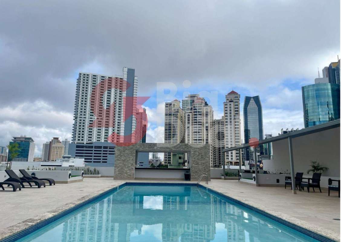 Rooftop infinity pool with lounge chairs and skyline view at PH Denovo Obarrio Panama City