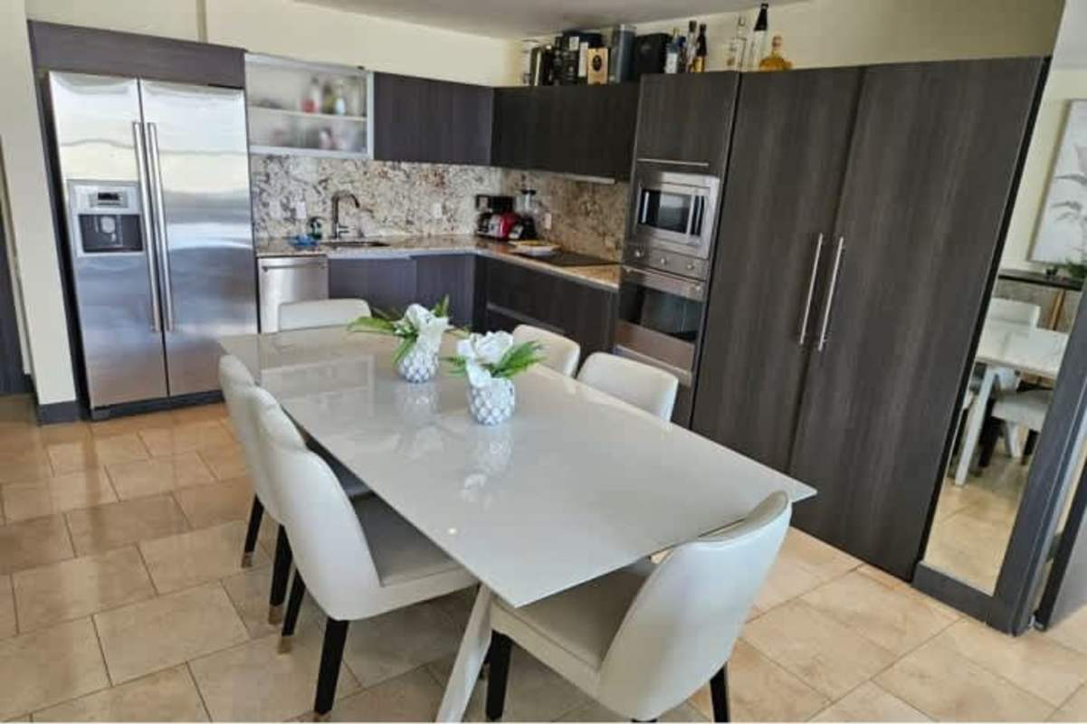 Elegant kitchen with granite island and modern cabinetry Punta Pacifica PH TOC Panama City