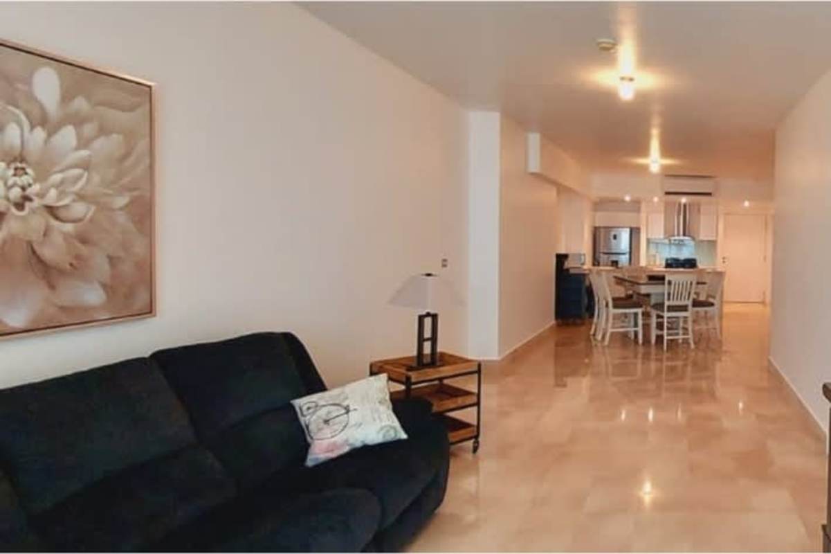 Modern open kitchen with dining area, marble floors and designer finishings at PH Yoo Panama