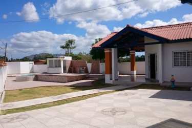 Covered patio terrace over tiled floor adjacent to swimming pool in Nueva Gorgona