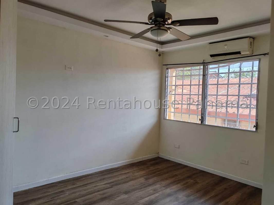 Bright living room with French glass doors, ceiling fan and ceramic tile in house Villa Zaita Panama