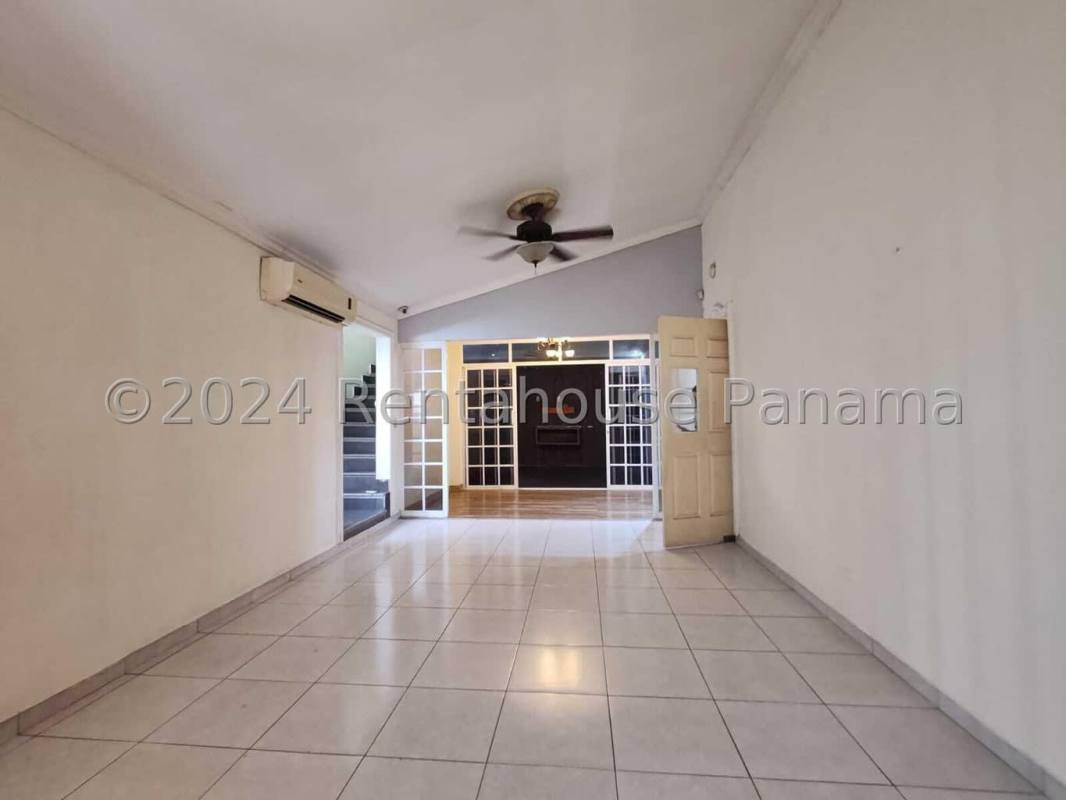 Kitchen granite countertops, wood cabinetry, mosaic backsplash in duplex house Panama