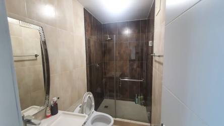 Luxurious master bedroom with large bed and balcony access ocean view in Coronado rental