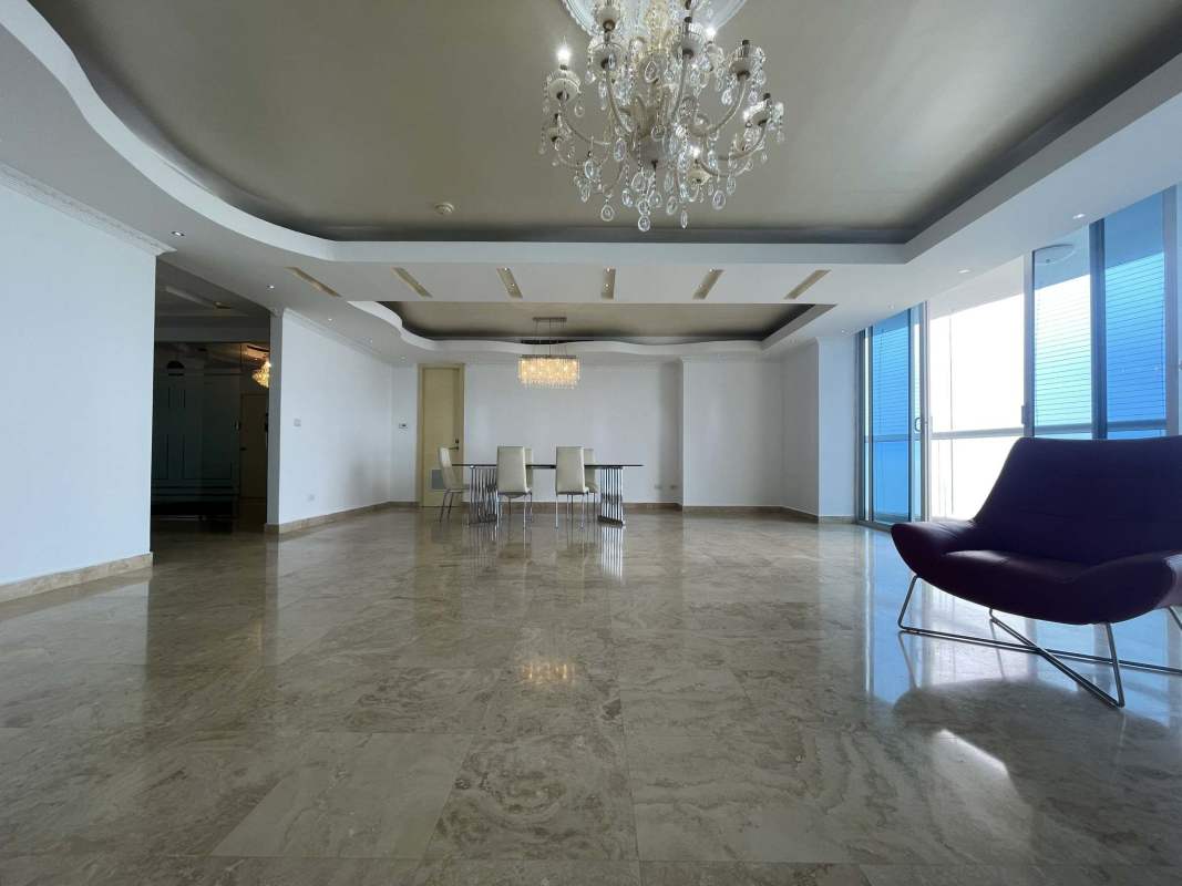 Spacious kitchen with granite counters, island, large windows at PH Pearl Costa del Este Panama