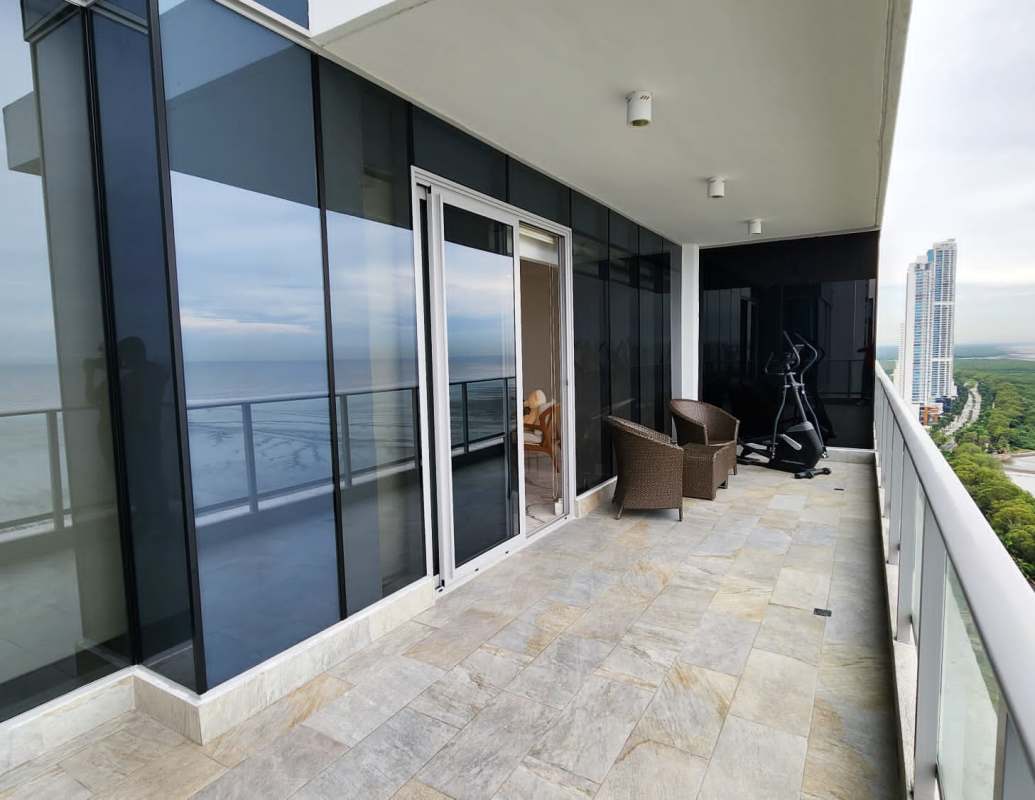 Modern open living and dining area with marble floors, panoramic sea views in PH Regalia Panama