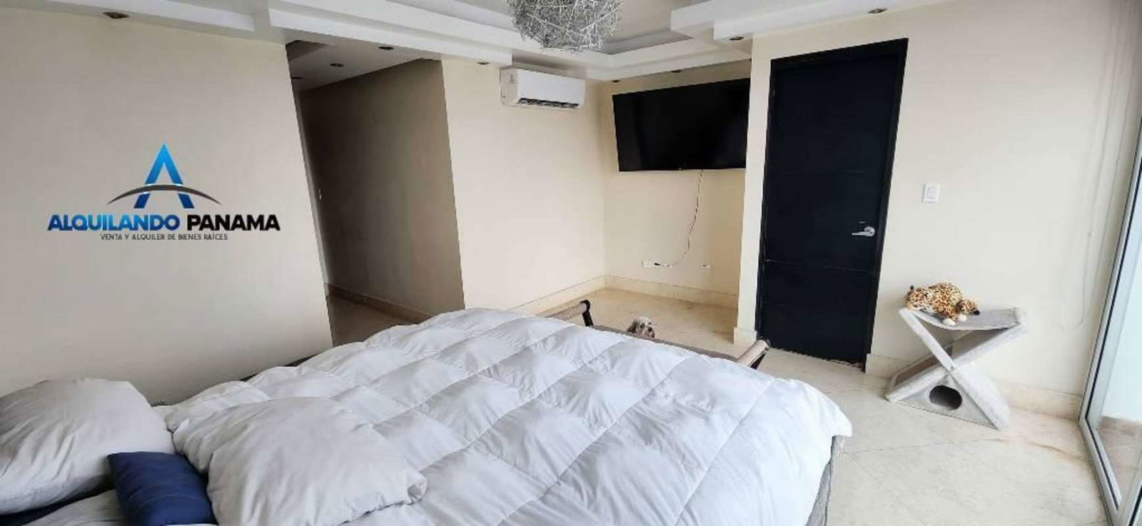 Modern bedroom with king bed, skyline views and contemporary decor at PH Highland View Panama City