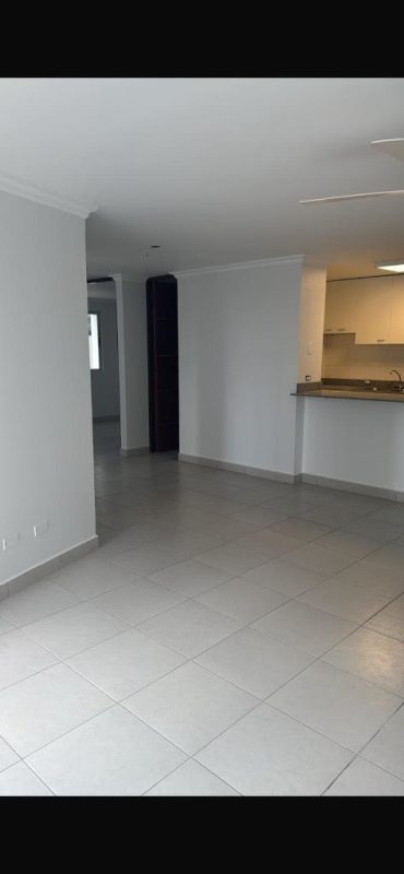 Open plan living room connected with kitchen bar PH Central Park apartment in Panama