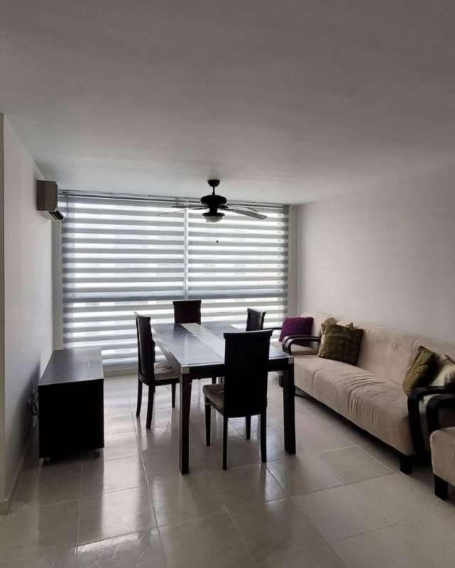 Modern minimalist living-dining room with AC and balcony access at PH McGregor Point Panama City