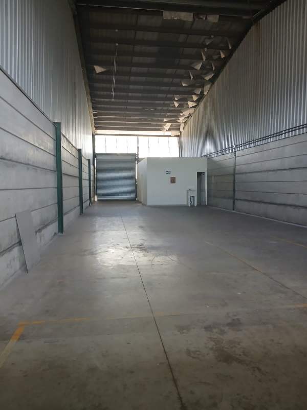 View of open industrial warehouse space with concrete floors and metal walls Villa Zaita Panama