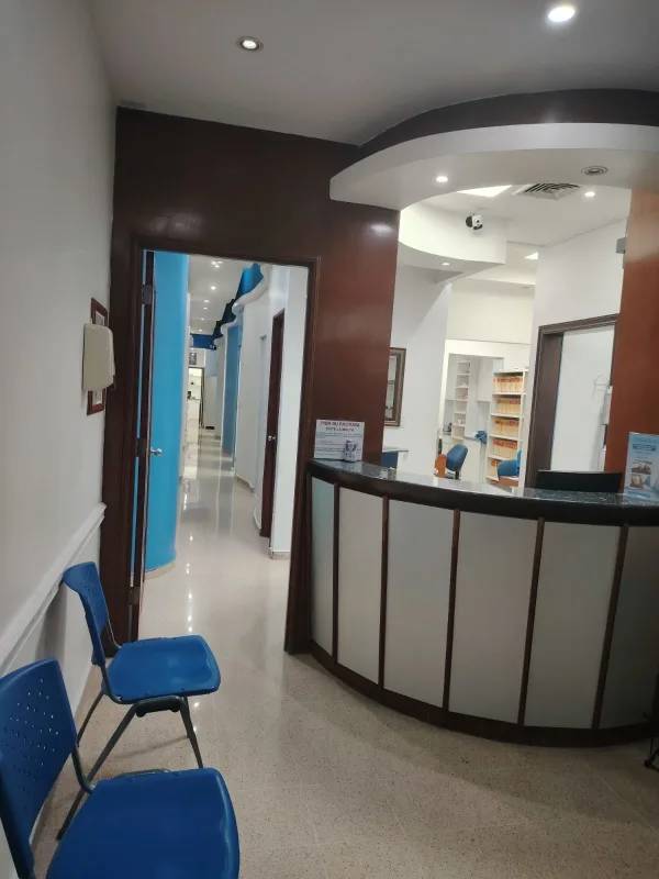 Modern commercial complex brick and glass facade with signage on Vía España Panama City