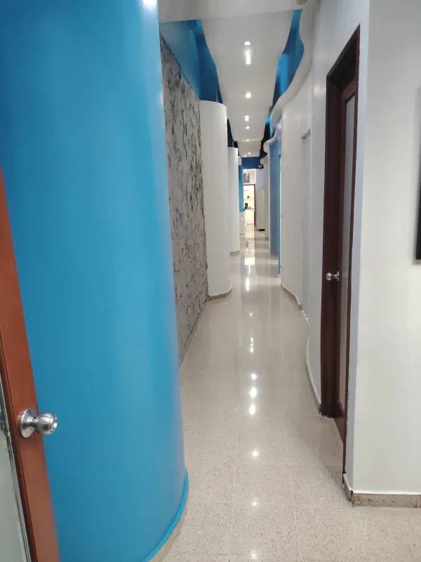 Bright commercial property corridor with curved walls and accent lighting Panama City