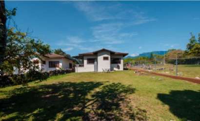 Spacious fenced backyard of new house in Alto Boquete Chiriquí with lawn and garden space