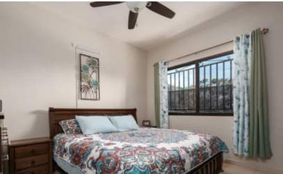 Bright living room with ceramic tile floors, ceiling fan, terrace view in new house Alto Boquete Panama
