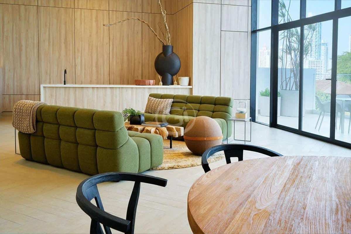 Contemporary kitchen with large island, white cabinetry, pendant lighting, and built-in appliances at PH Ocean House Coco del Mar Panama