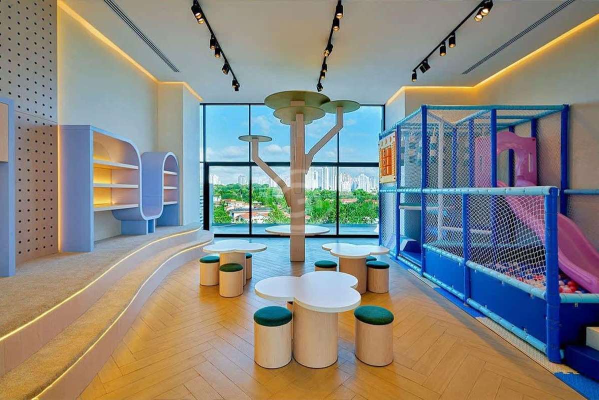 Colorful indoor children's playground with safety mats and swings in PH Ocean House Panama City