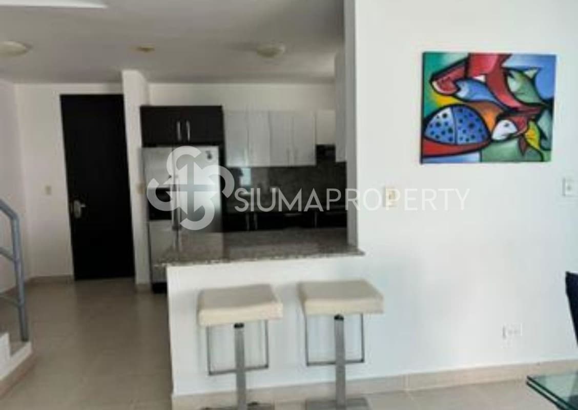 Open kitchen with granite countertops, breakfast bar and modern appliances PH Concept Penthouse Obarrio Panama