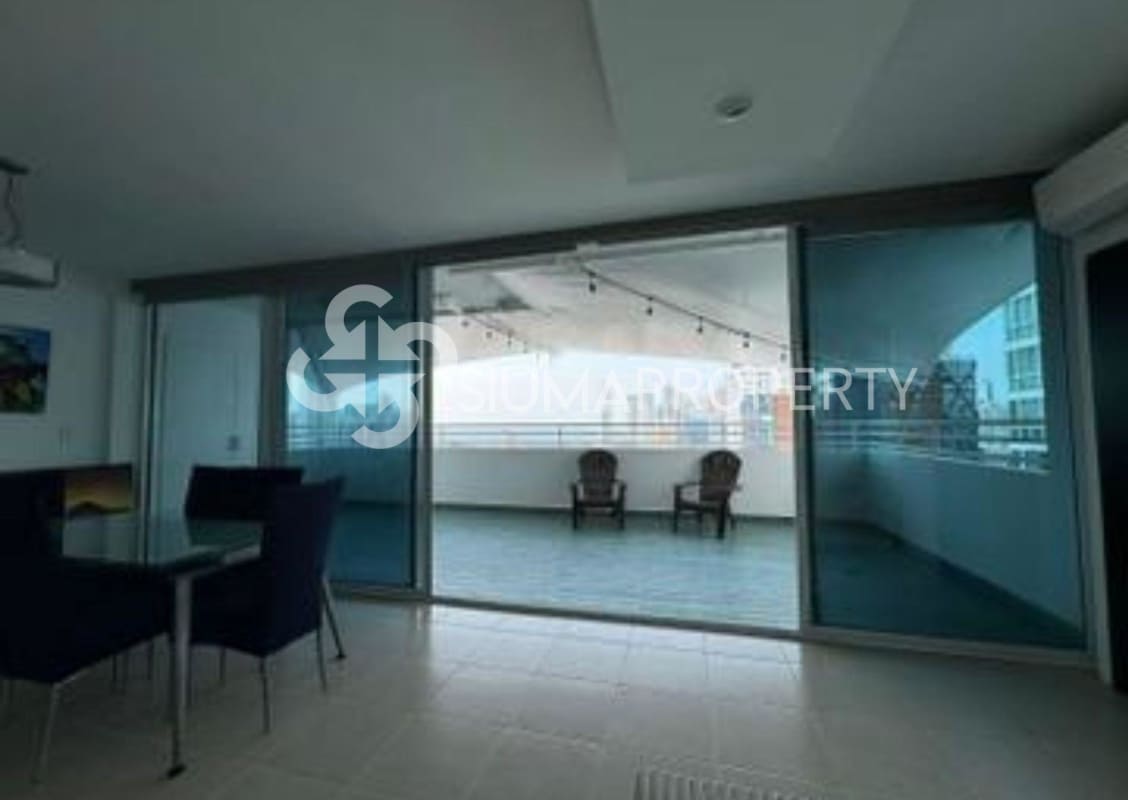 Dining space with access to private terrace overlooking city skyline in PH Concept Penthouse Panama