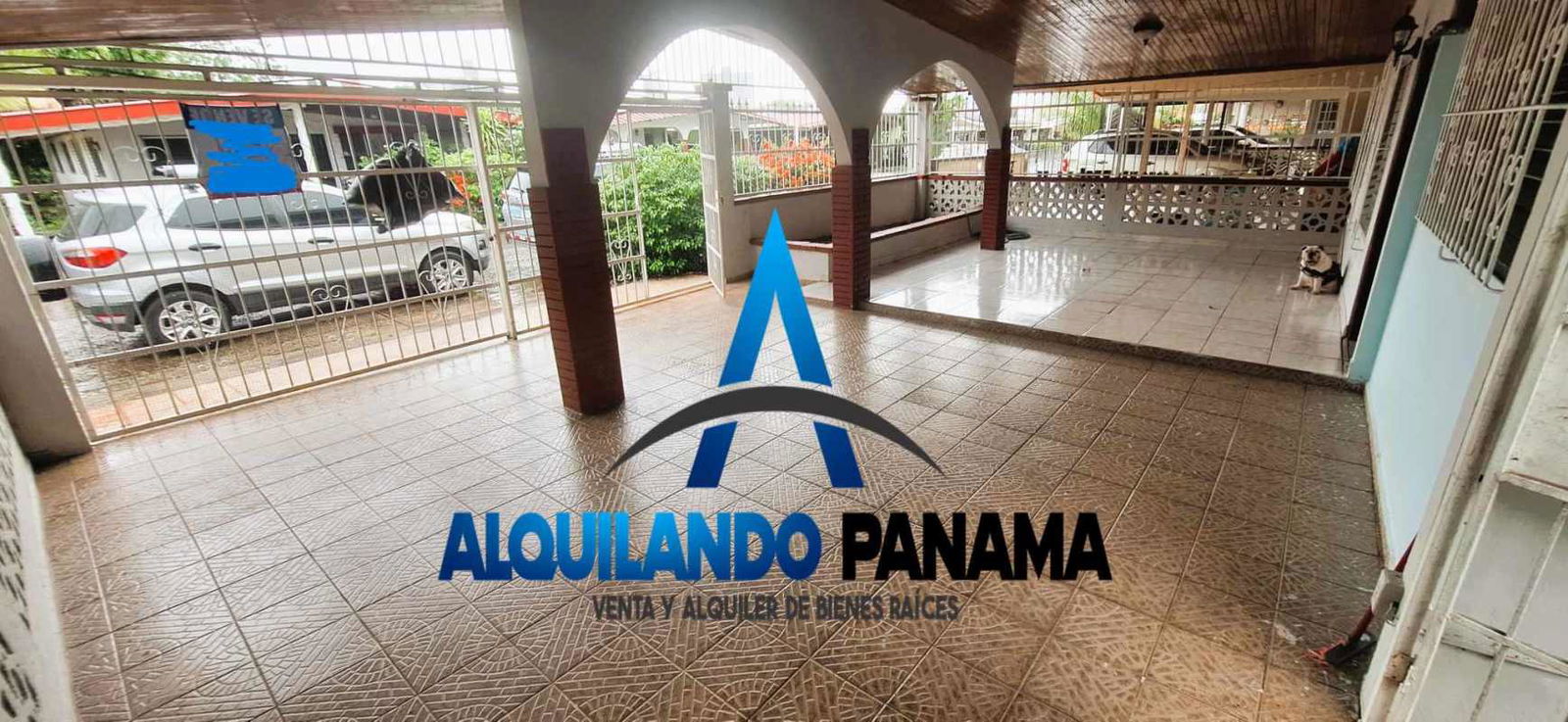 Large living room with tile floor wooden ceiling windows curtains traditional Panama house