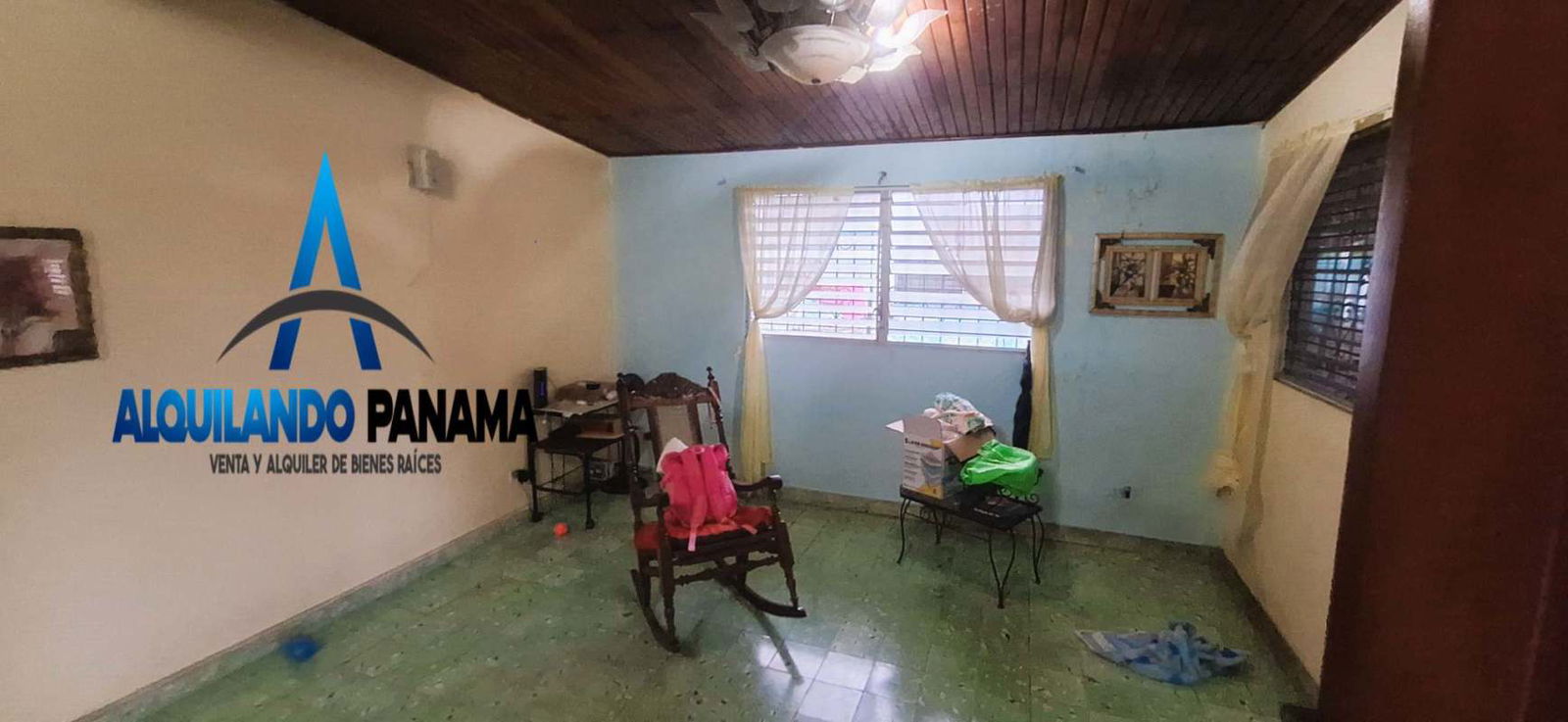 Side facade with metal security bars green garden area and walkway Panama City