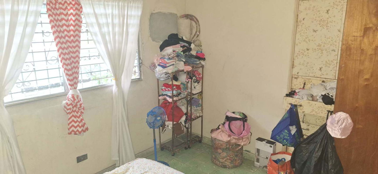 Bedroom with blue walls windows security bars affordable house in Panama city