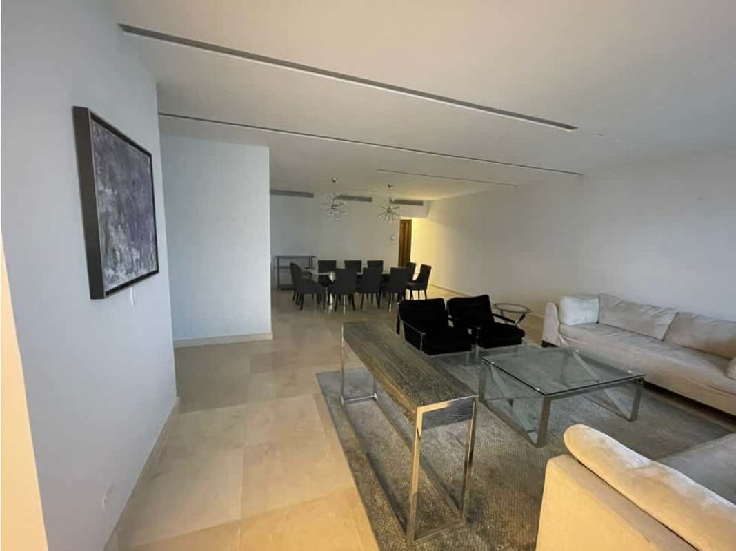 Bright spacious living room with sectional sofa and urban views PH Aventura Tower Panama City
