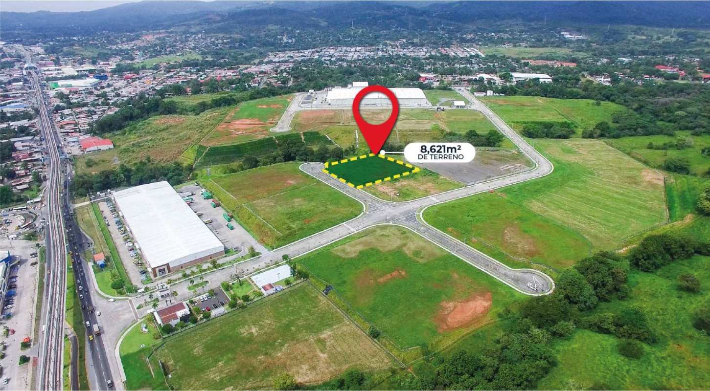Panoramic aerial view showing 8,621 m² commercial lot near airport in growing logistics area