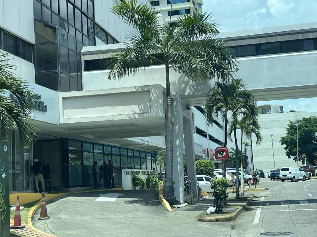 Modern commercial medical building exterior with glass windows and entrance canopy Punta Paitilla Panama