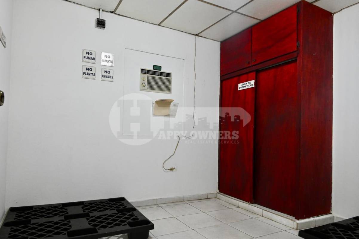 Utility area or storage with tiled floor, AC unit, signage and shelving Pueblo Nuevo Panama