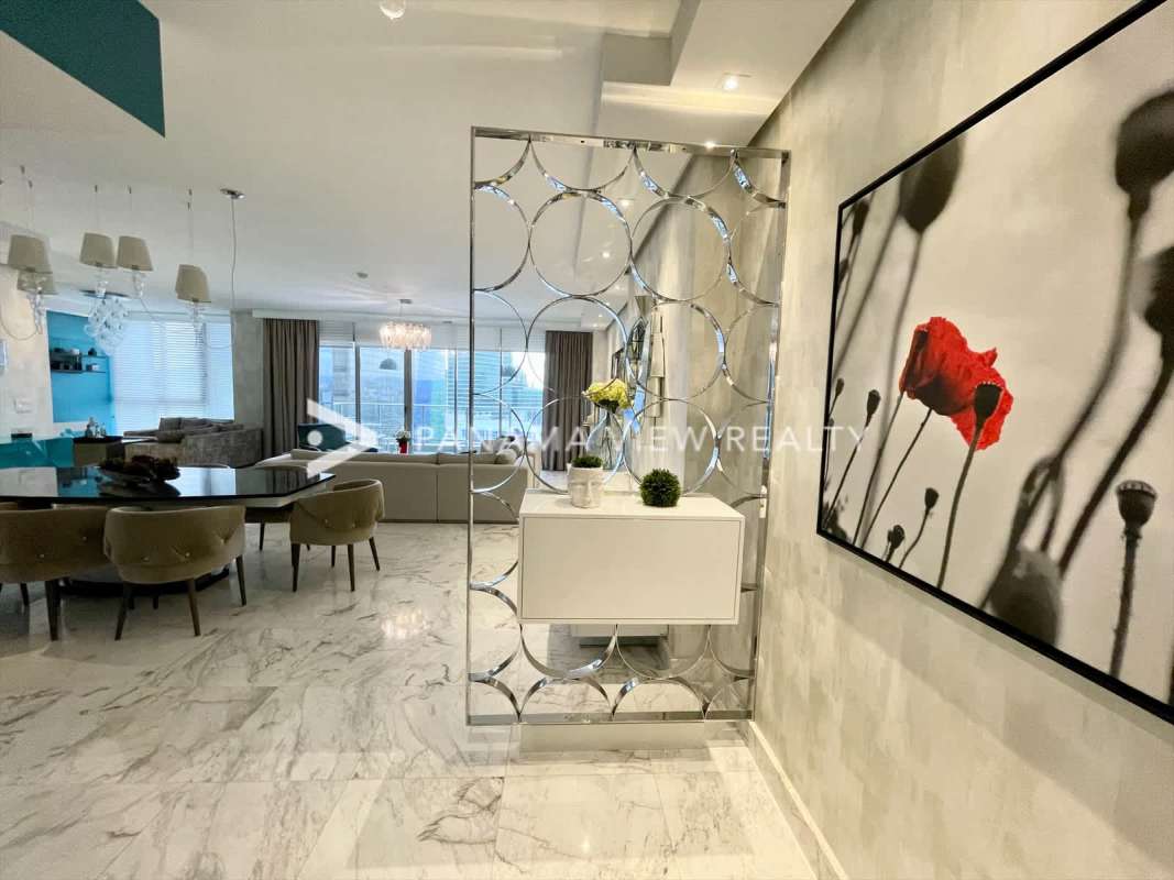 Spacious living area with marble floors panoramic windows in PH Regalia Costa del Este Panama City