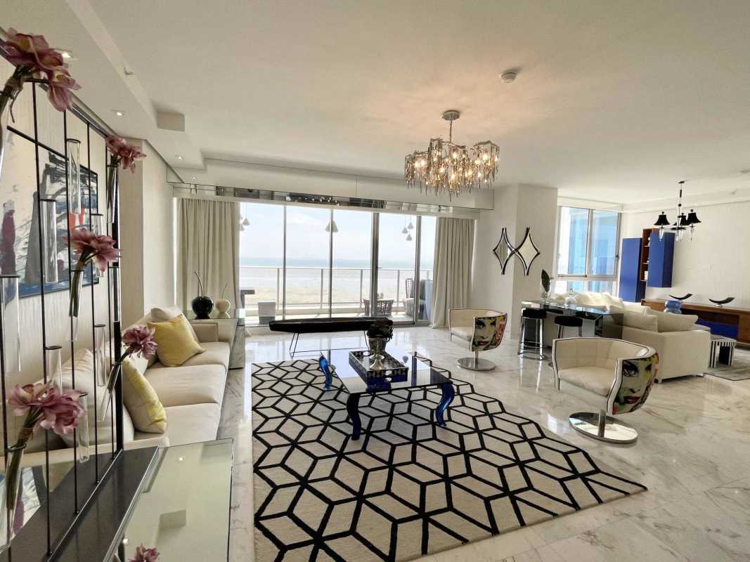 Bright open living space with marble flooring and ocean views at PH Regalia Costa del Este Panama