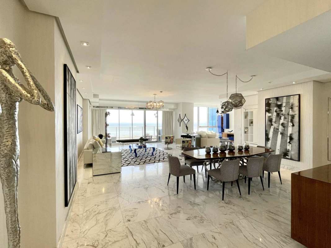 Modern open-plan living space with marble floors, luxury furniture, ocean views in PH Regalia Costa del Este