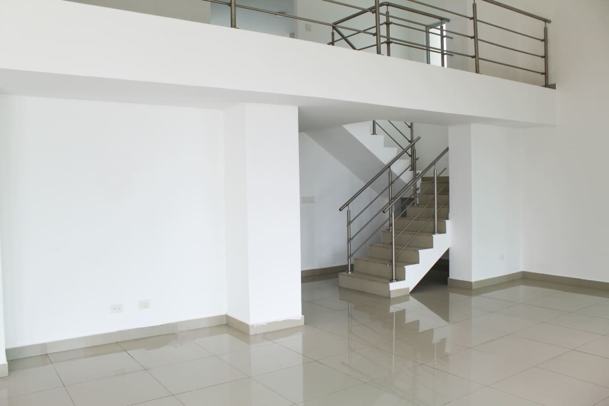 Balcony with glass railing and skyline & ocean views at PH Sevilla Panama