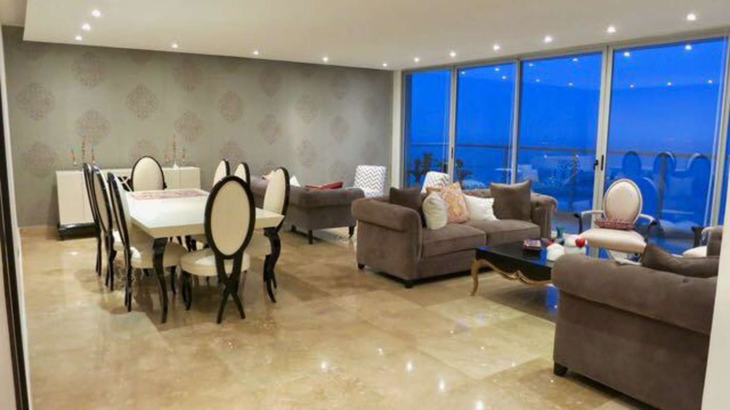 Open plan living dining space with panoramic floor-to-ceiling windows PH Ocean Club Punta Pacifica Panama